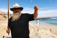 Finchy holding fish up at Greenly Beach near Coffin Bay