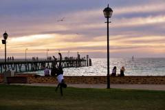 Sitting on the seawall at Glenelg