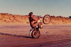 TL 125 on the back wheel along the beach. Photo credit D. Harvey