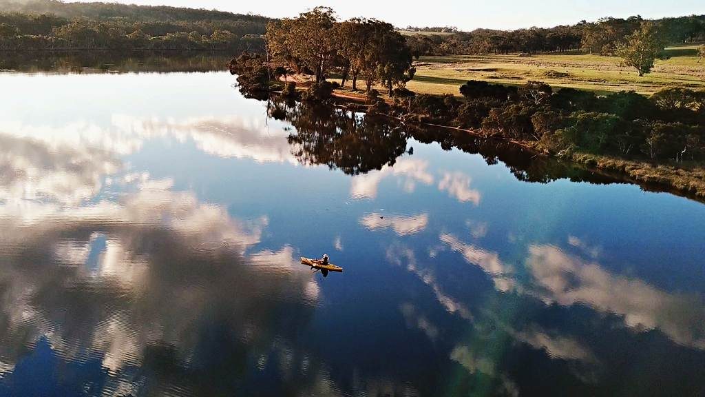 Finchy kayaking the Kalgan River on a calm afternoon