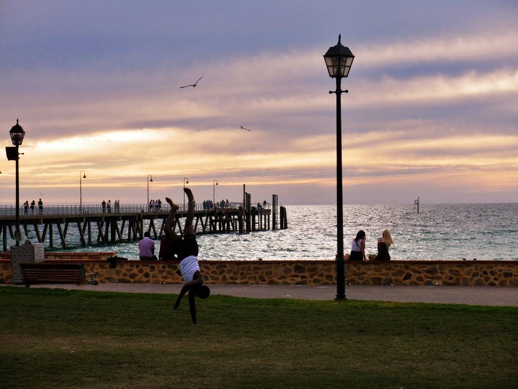 Sitting on the seawall at Glenelg