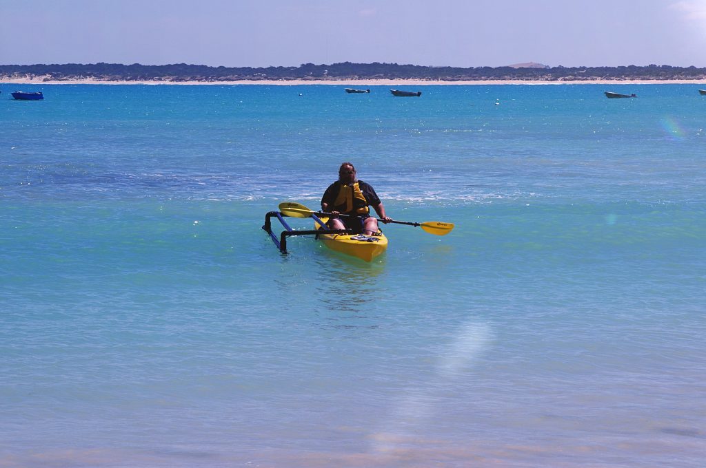 Finchy and his home-made out rigger kayaking at Southend