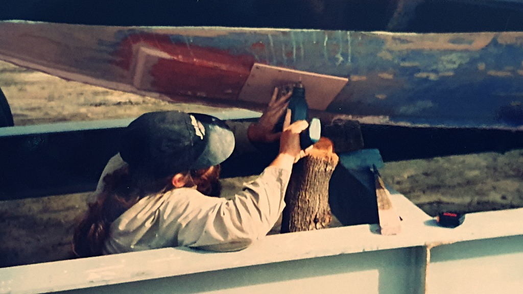 Finchy putting a patch on the hole in the bondwood hull